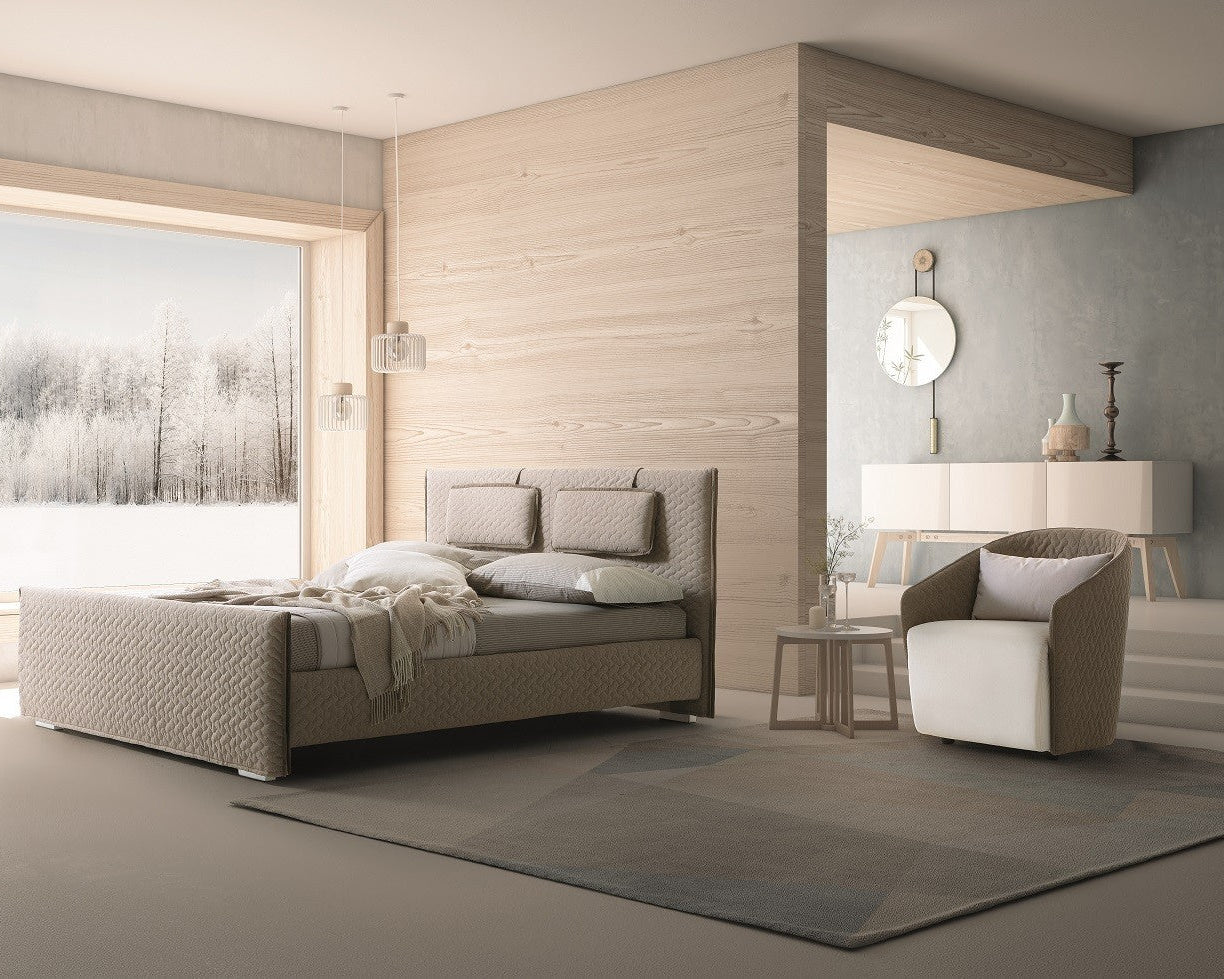 Evergreen modern bedroom with a bed, chair, and large window