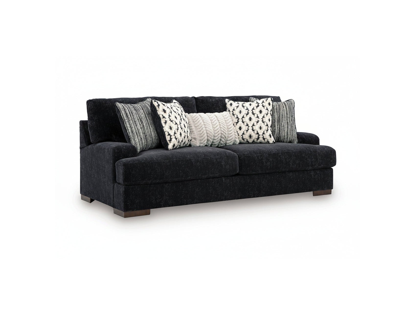 Black sofa with patterned cushions on a white background