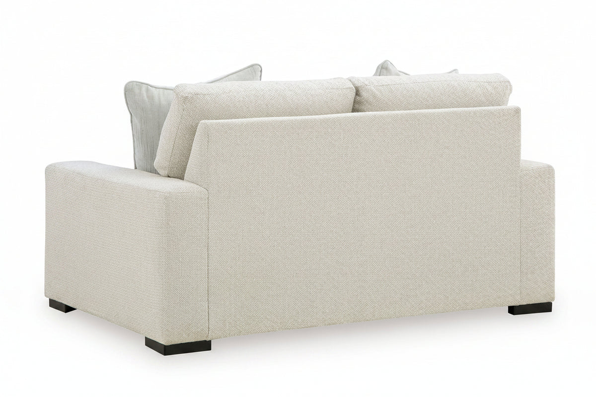 Beige sofa with cushions on a white background