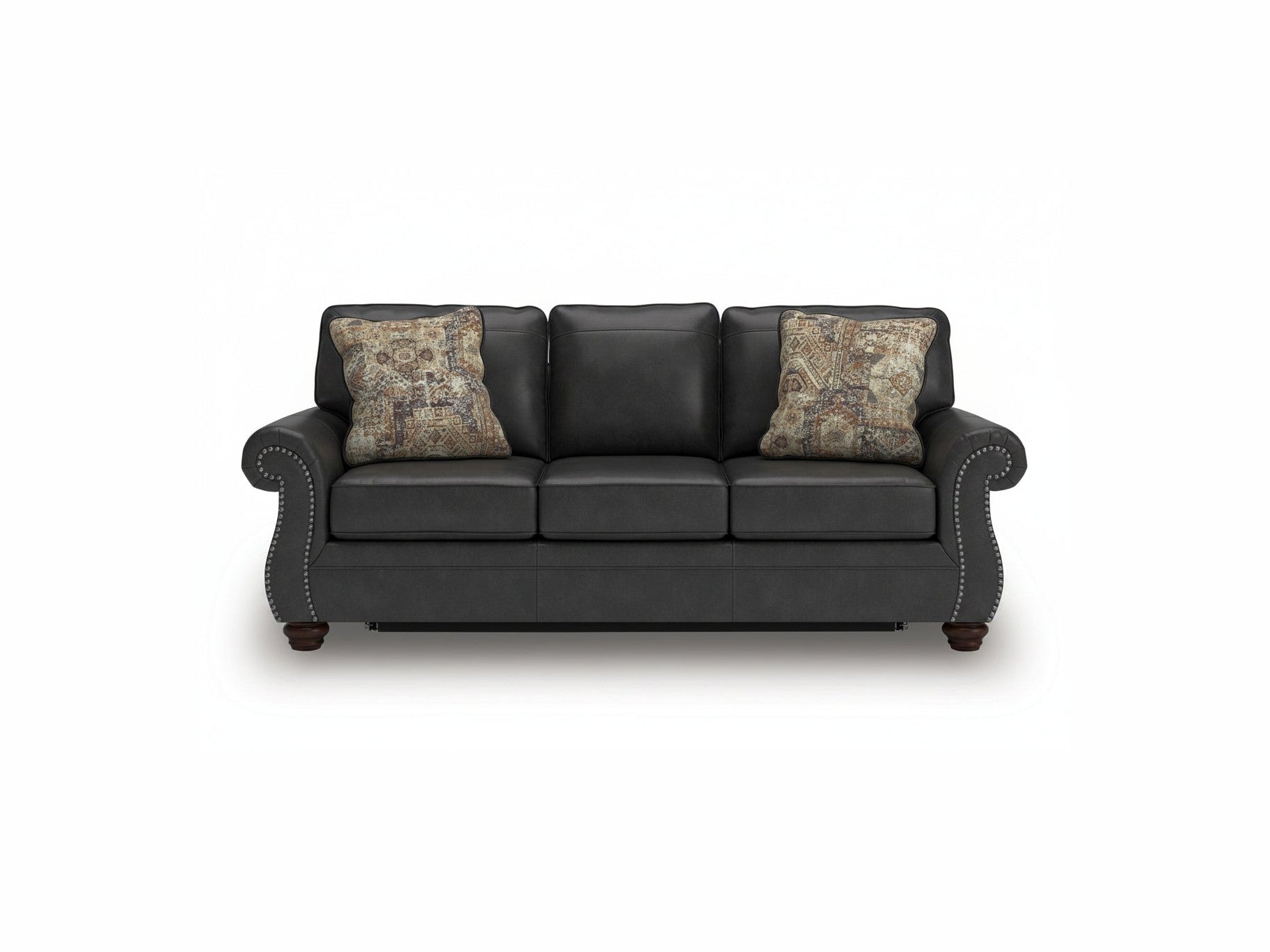 Black leather sofa with patterned cushions on a white background