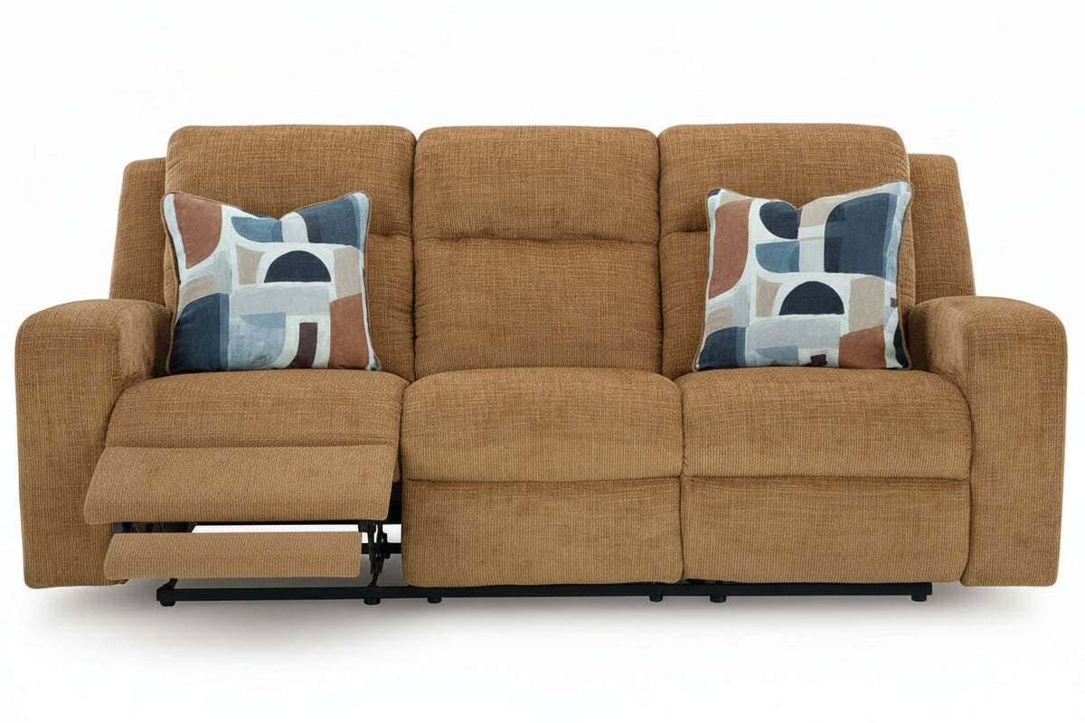Brown sofa with patterned cushions on a white background