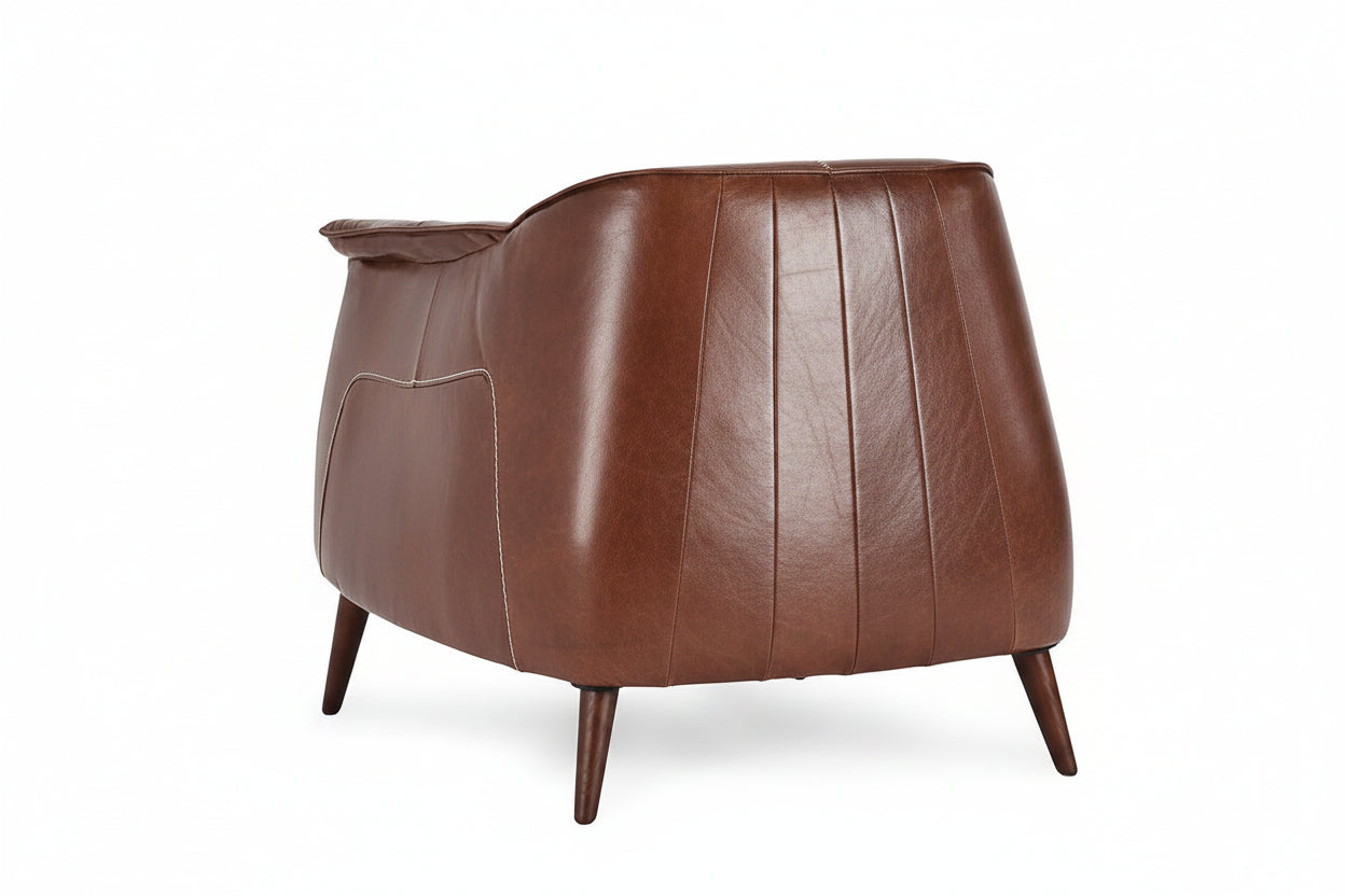 Brown leather armchair on a white background