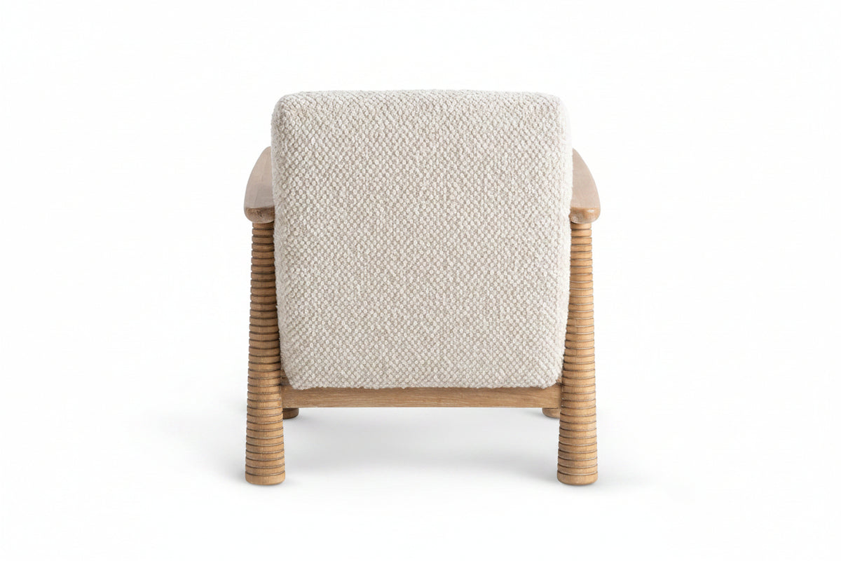 Chair with woven frame and textured beige cushion on a white background