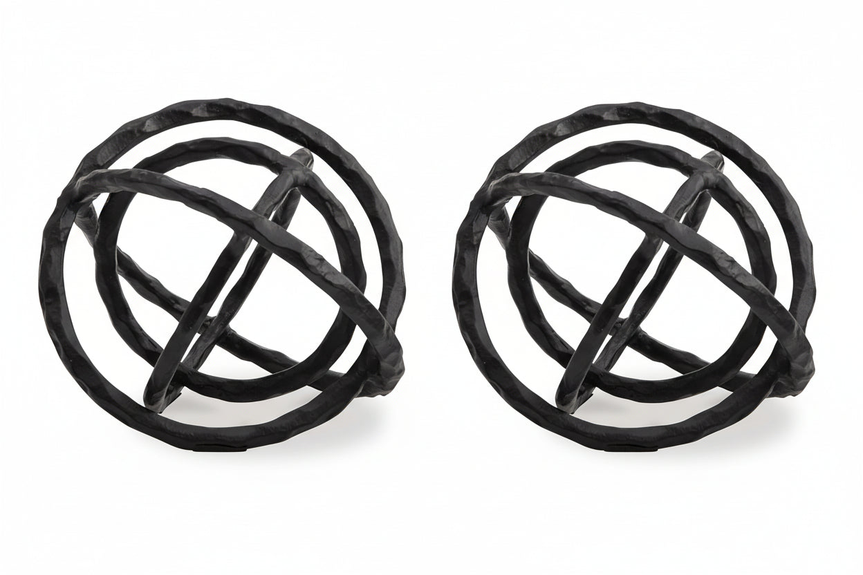 The Barley two black spherical decorative objects with an interwoven design on a white background.