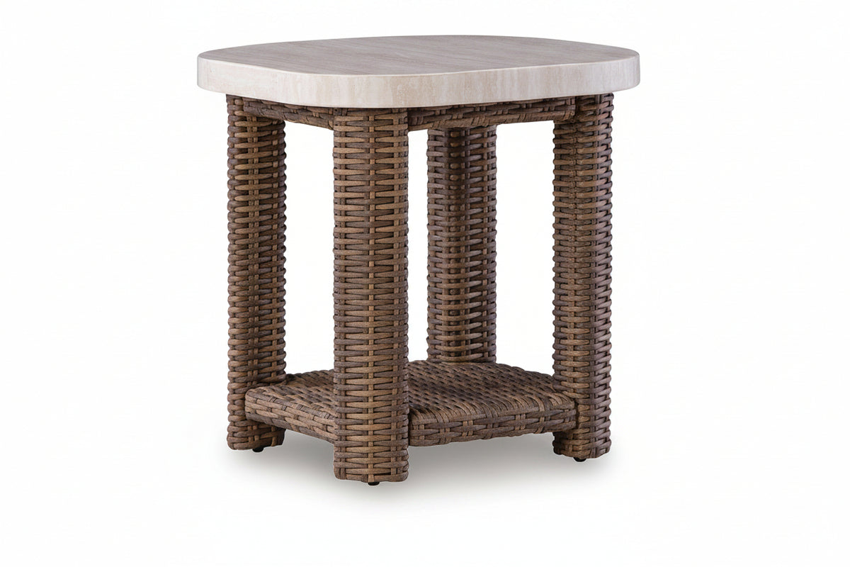 Round outdoor table with wicker frame and stone-like top on a white background