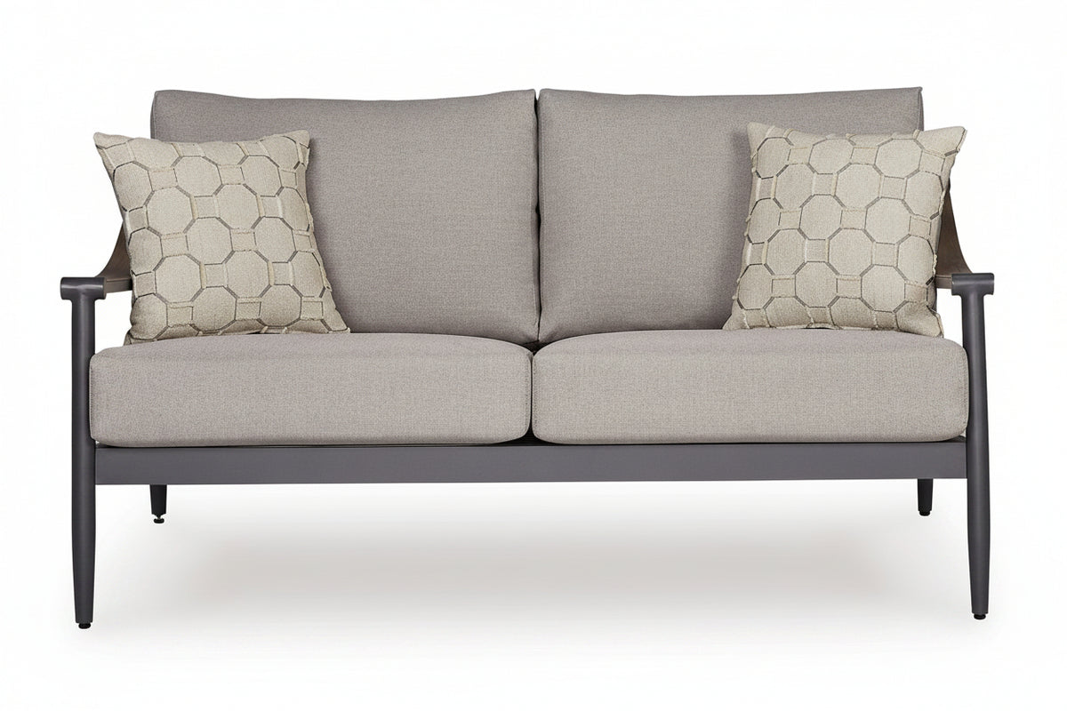 Gray sofa with patterned cushions on a white background