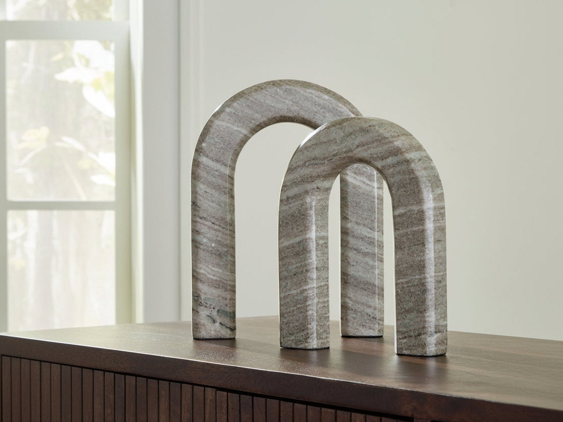 The Keithton two-stone arch sculptures on a wooden surface with a neutral background.