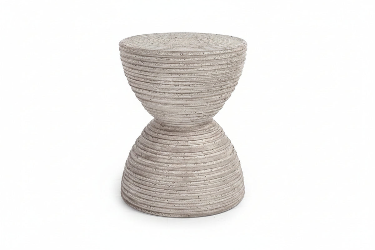 Concrete side table with textured surface on a white background