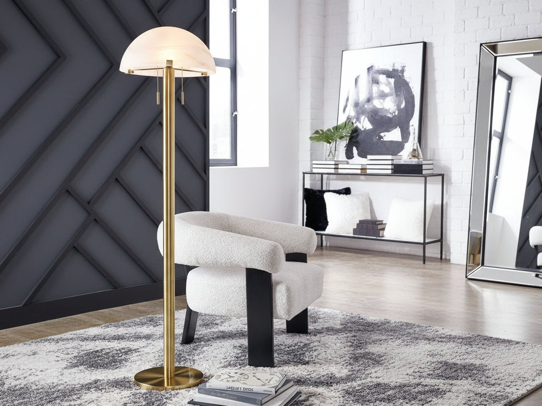 Tobbinsen floor lamp in a modern living room setting with a chair and decor.