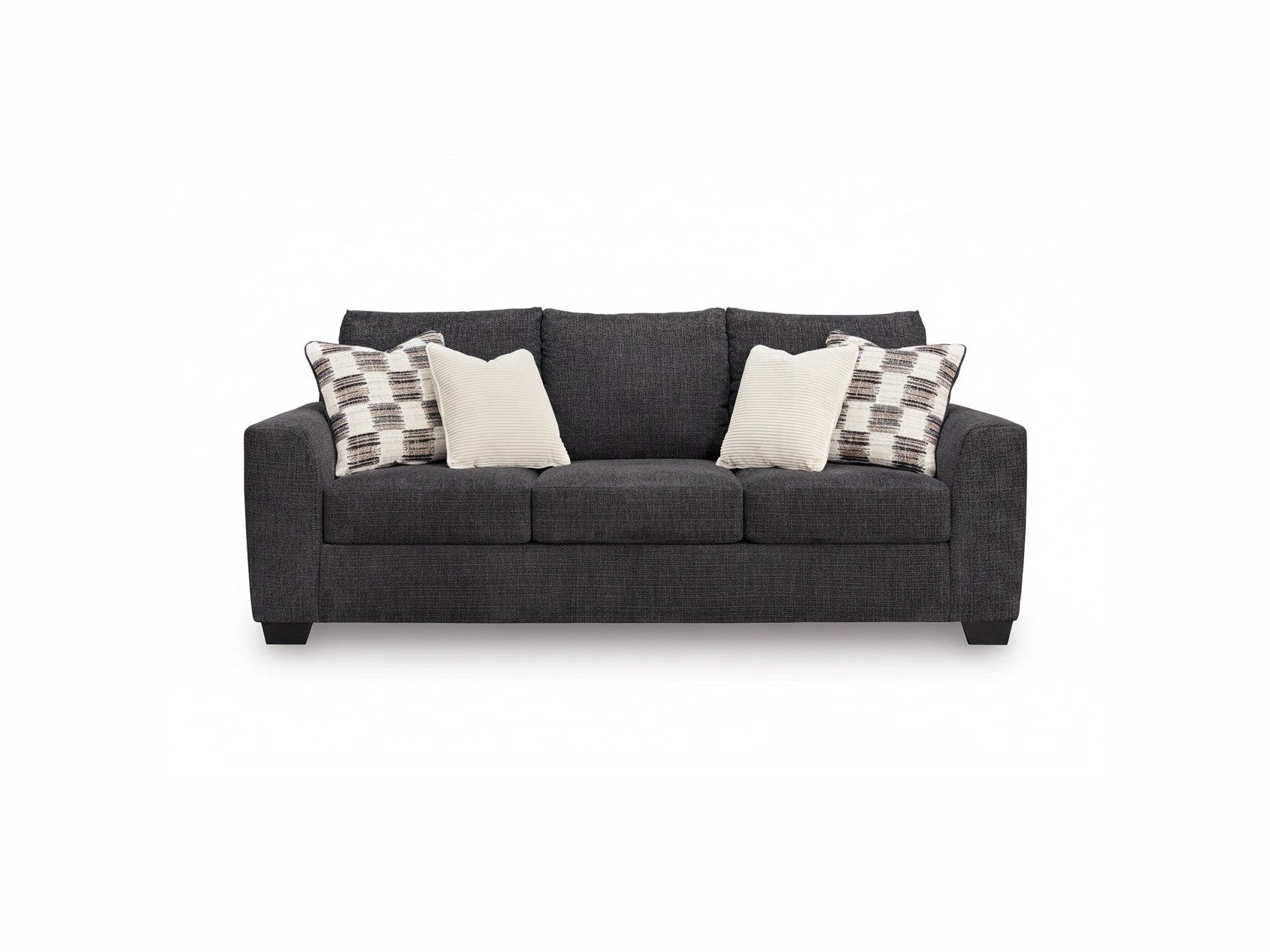 Gray sofa with patterned and plain cushions on a white background