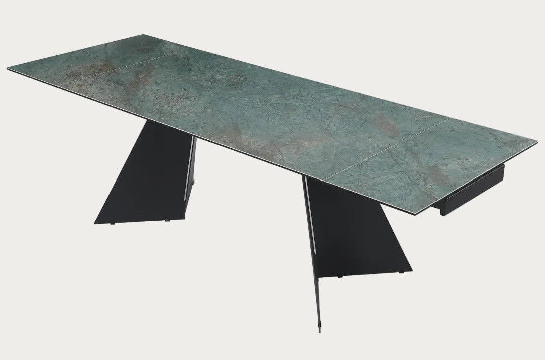 Helen modern dining table with greenish-brown marble-like top and black metal legs.