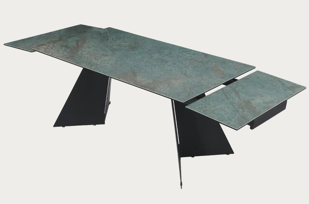 Helen modern dining table with green marble-like top and black metal legs.