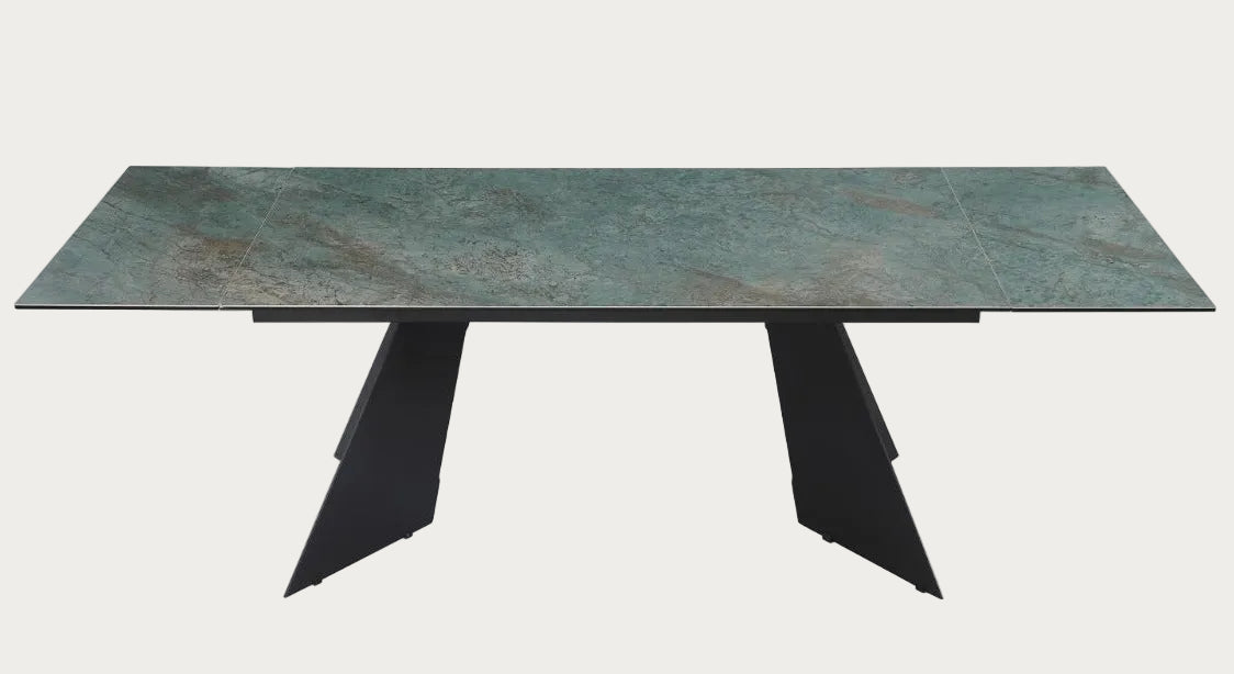 Rectangular table with green marble top and black metal legs on a white background