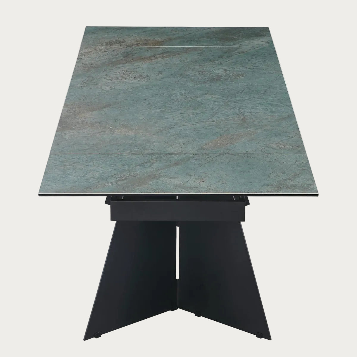 Helen dining table with a green marble-like top and black base