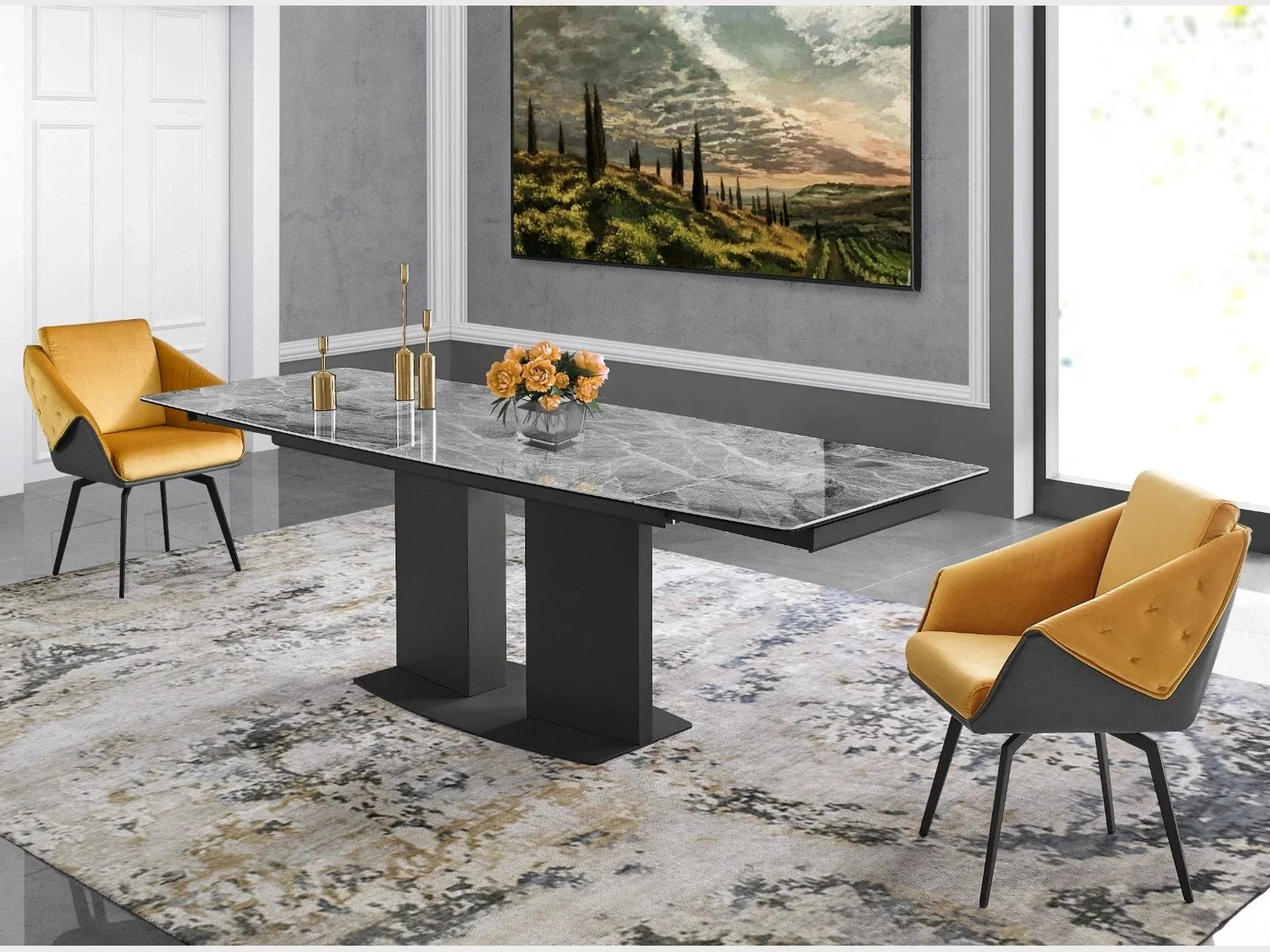 A modern grey marble dining table with a black pedestal base anchors a contemporary dining room featuring mustard yellow velvet chairs and a patterned area rug.