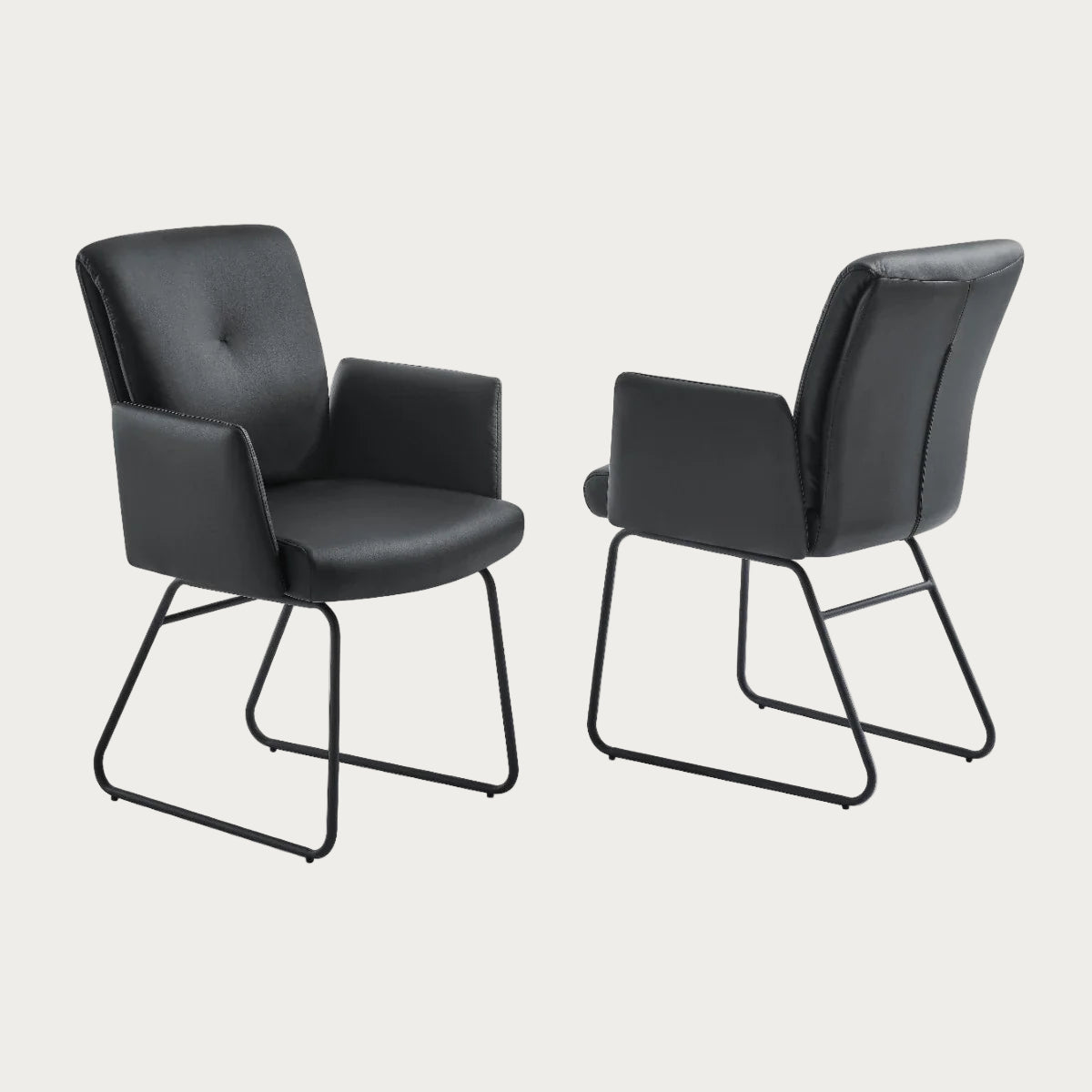 Cyprus dining armchair upholstered in black faux leather with black legs