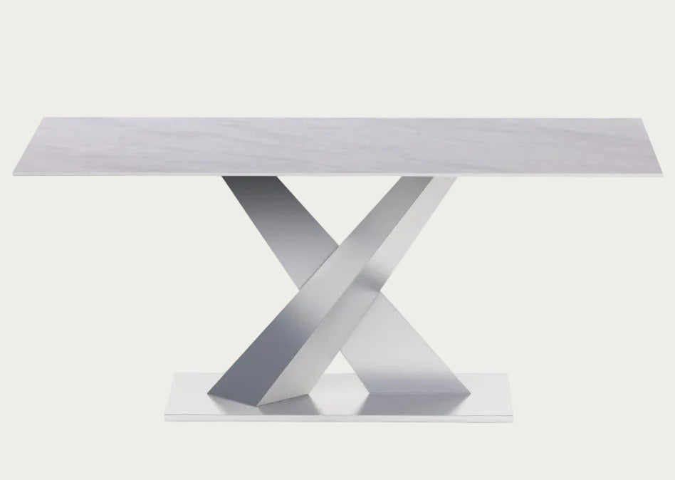 Jennifer modern dining table with a white top and metallic base.