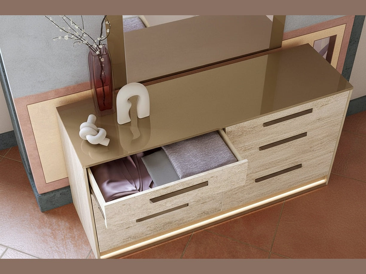 Close-up of the Jo dresser with an open drawer displaying clothes and decorative items on top.
