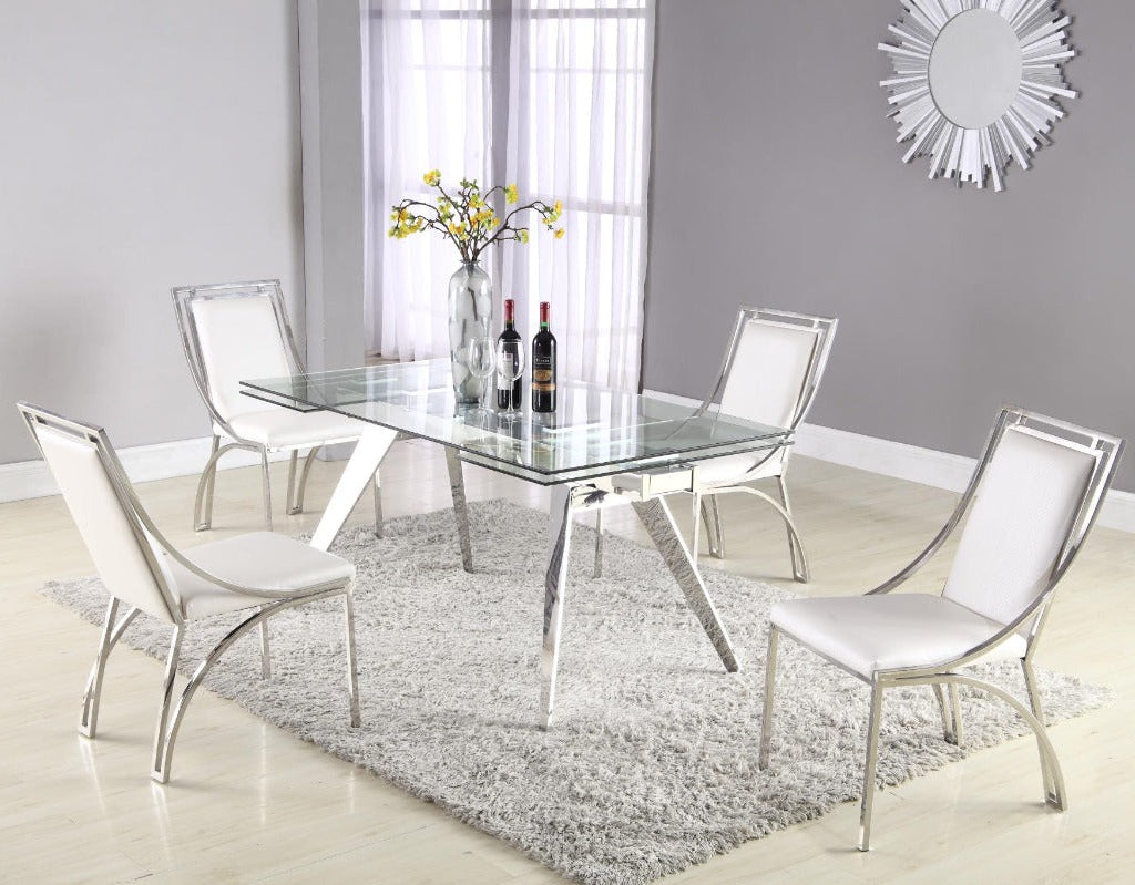 Dining room set with a glass table and four chairs on a gray rug.