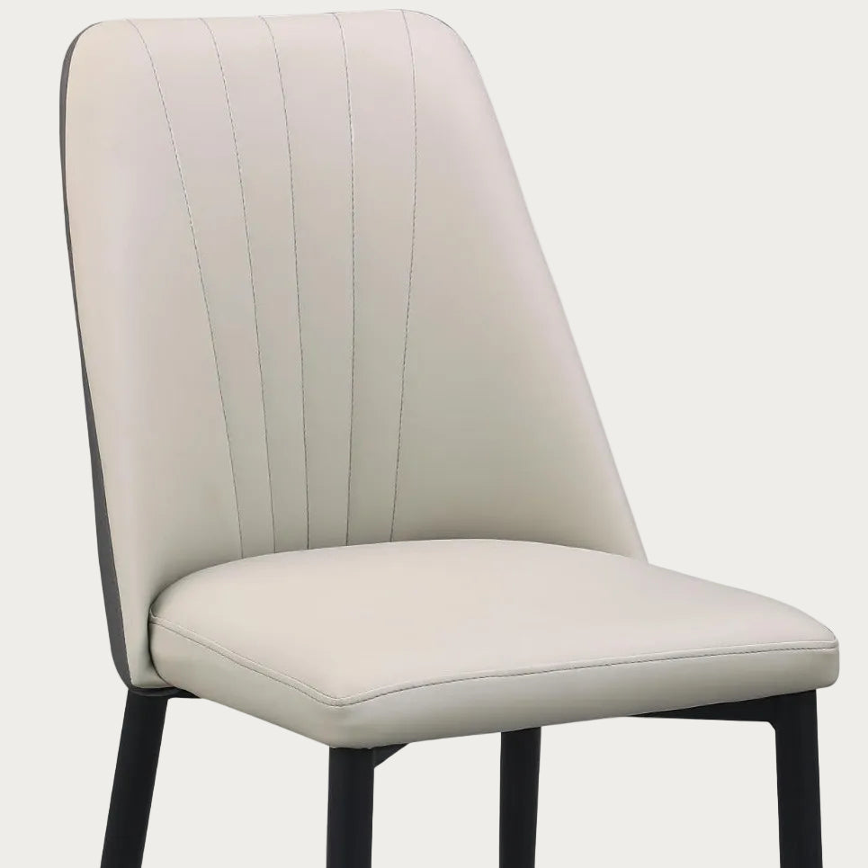 Beige chair with black legs on a white background