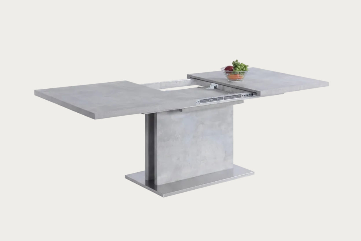 Kalinda gray concrete-style dining table with an extended leaf.