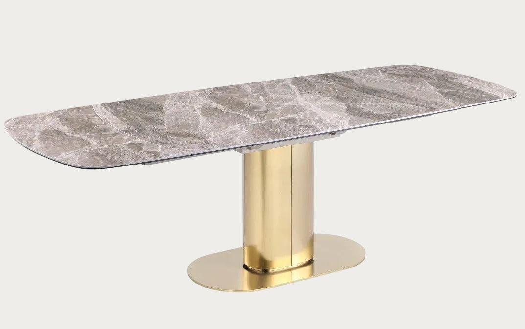 Karla dining table with marble top and gold base.