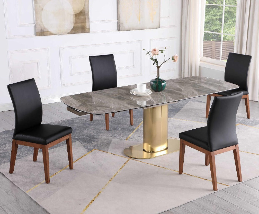 Karla Emma dining room set with a marble table and black chairs in a well-lit room.