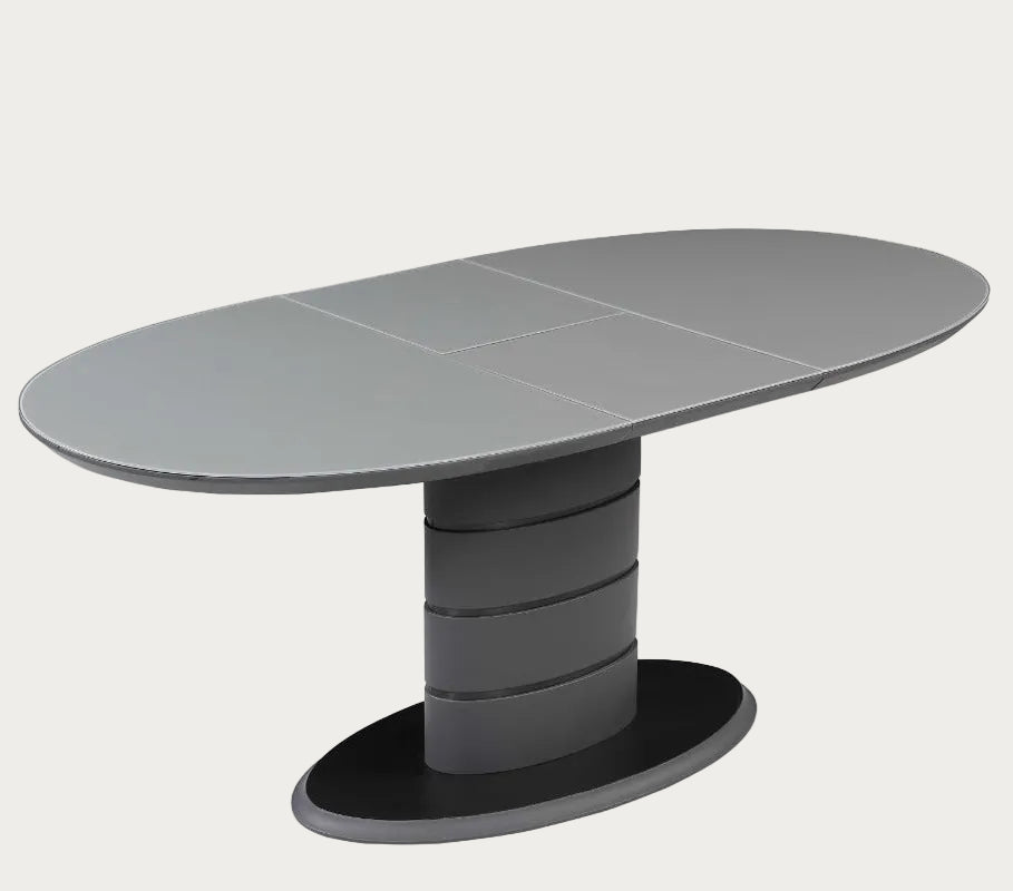 Kendra gray oval table with a unique cylindrical base.