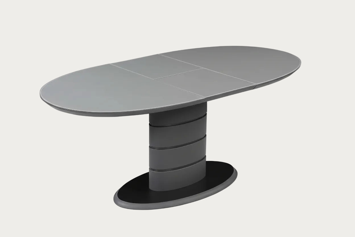 Kendra gray oval table with a unique cylindrical base.