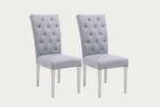 Two Kerry gray fabric upholstered chairs with tufted backrests on a white background