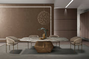 Modern dining room with a round table and chairs in a stylish interior setting.