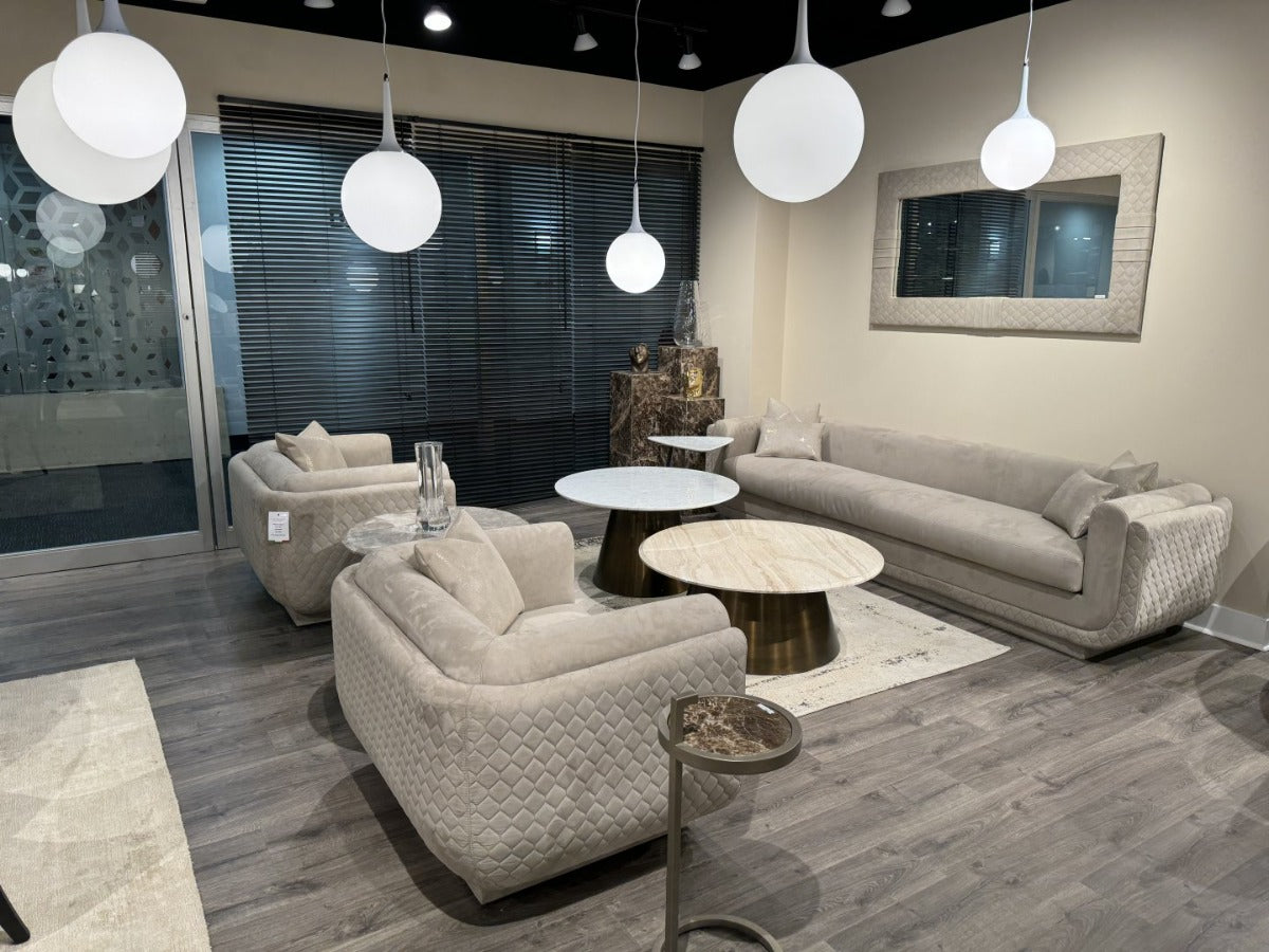 Sophie's modern living room has gray sofas, a coffee table, and pendant lights.