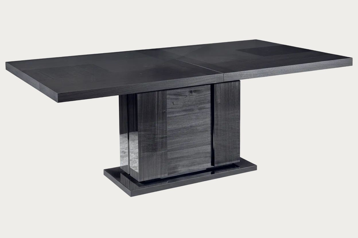 Montecarlo dark gray dining table with a modern design on a white background.
