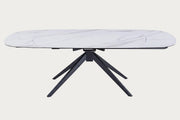 Nicole white oval table with black metal legs on a white background