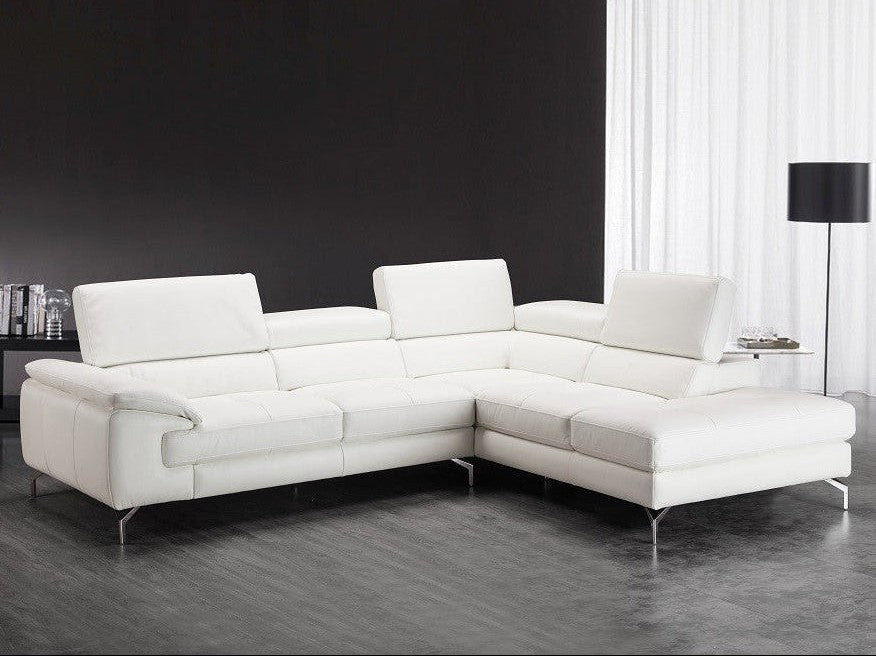 Nila white leather sectional sofa in a modern living room setting.