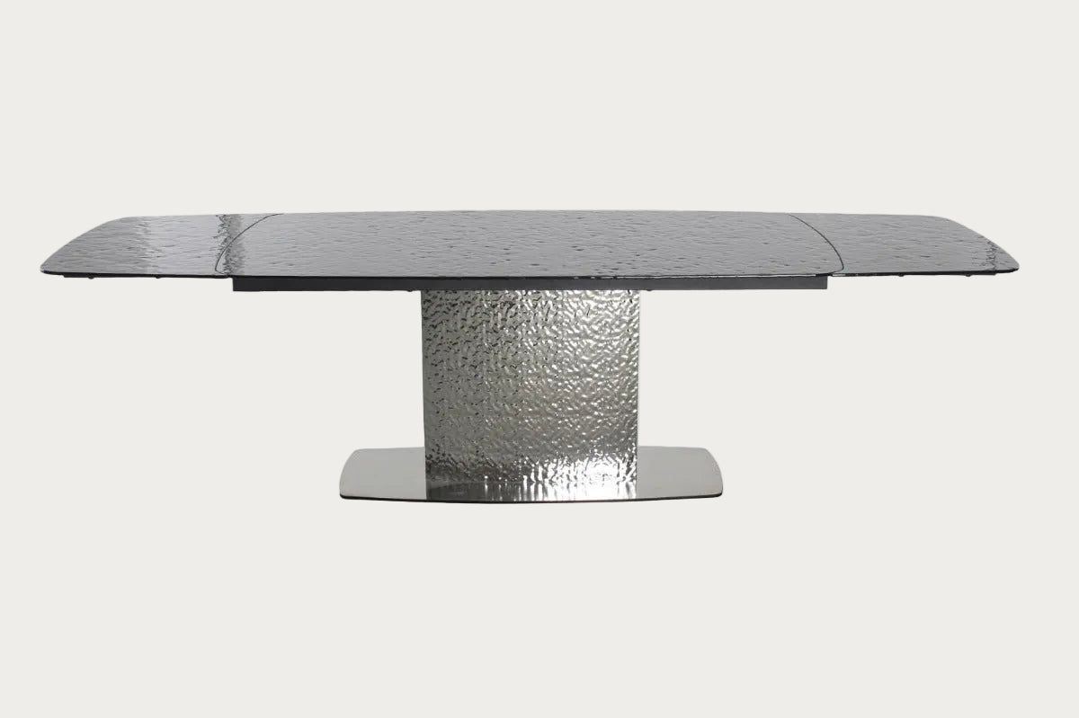 Nora dining table with textured base on a white background