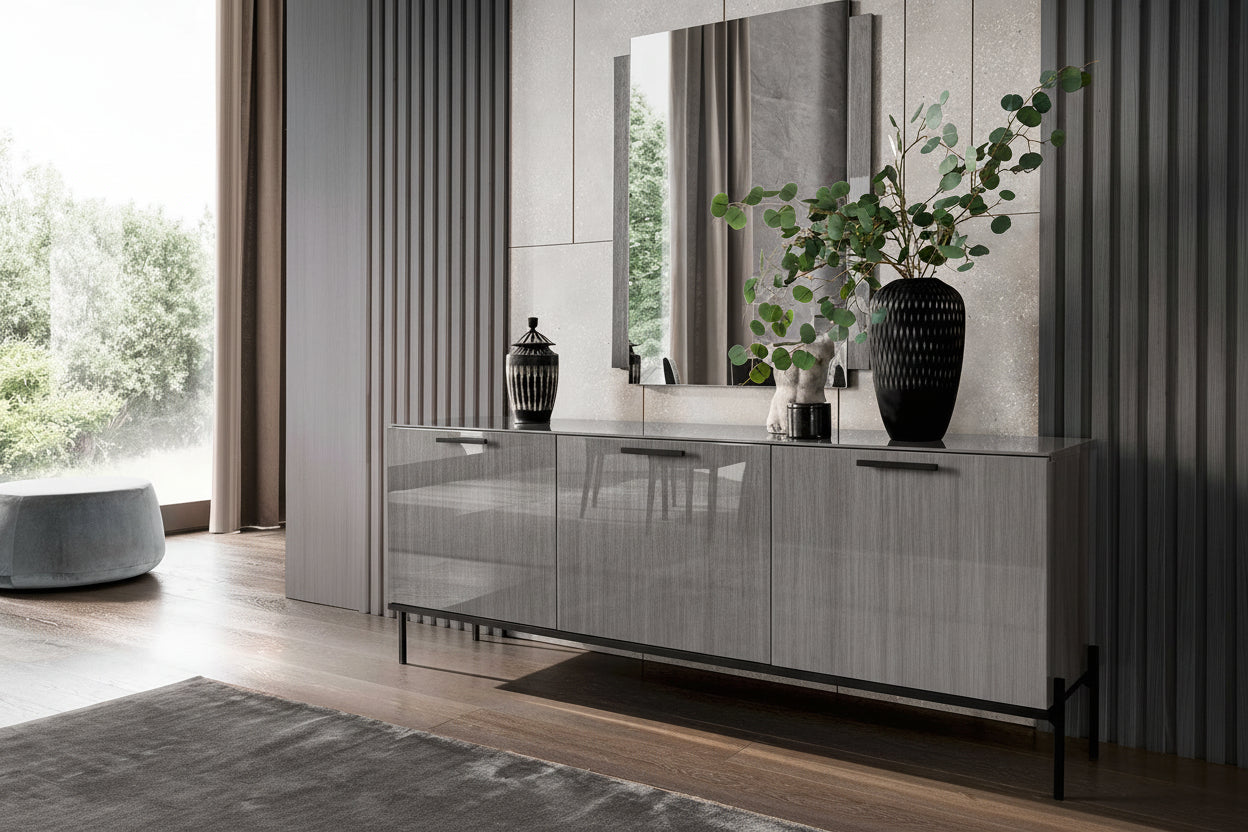 Modern living room with the Novecento gray sideboard, mirror, and decorative items.