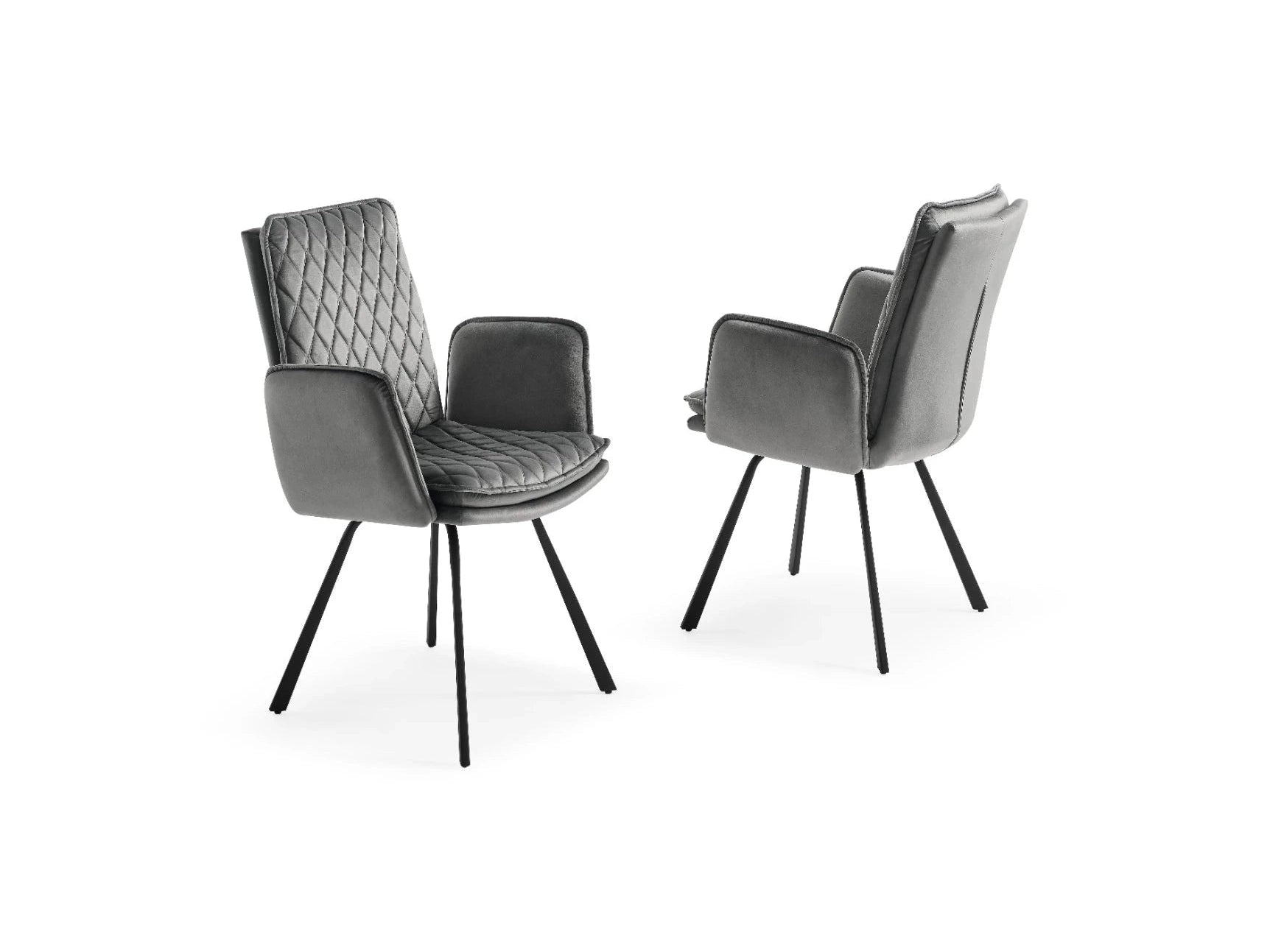 Two elegant grey velvet chairs showcase diamond-quilted upholstery and tapered black metal legs.