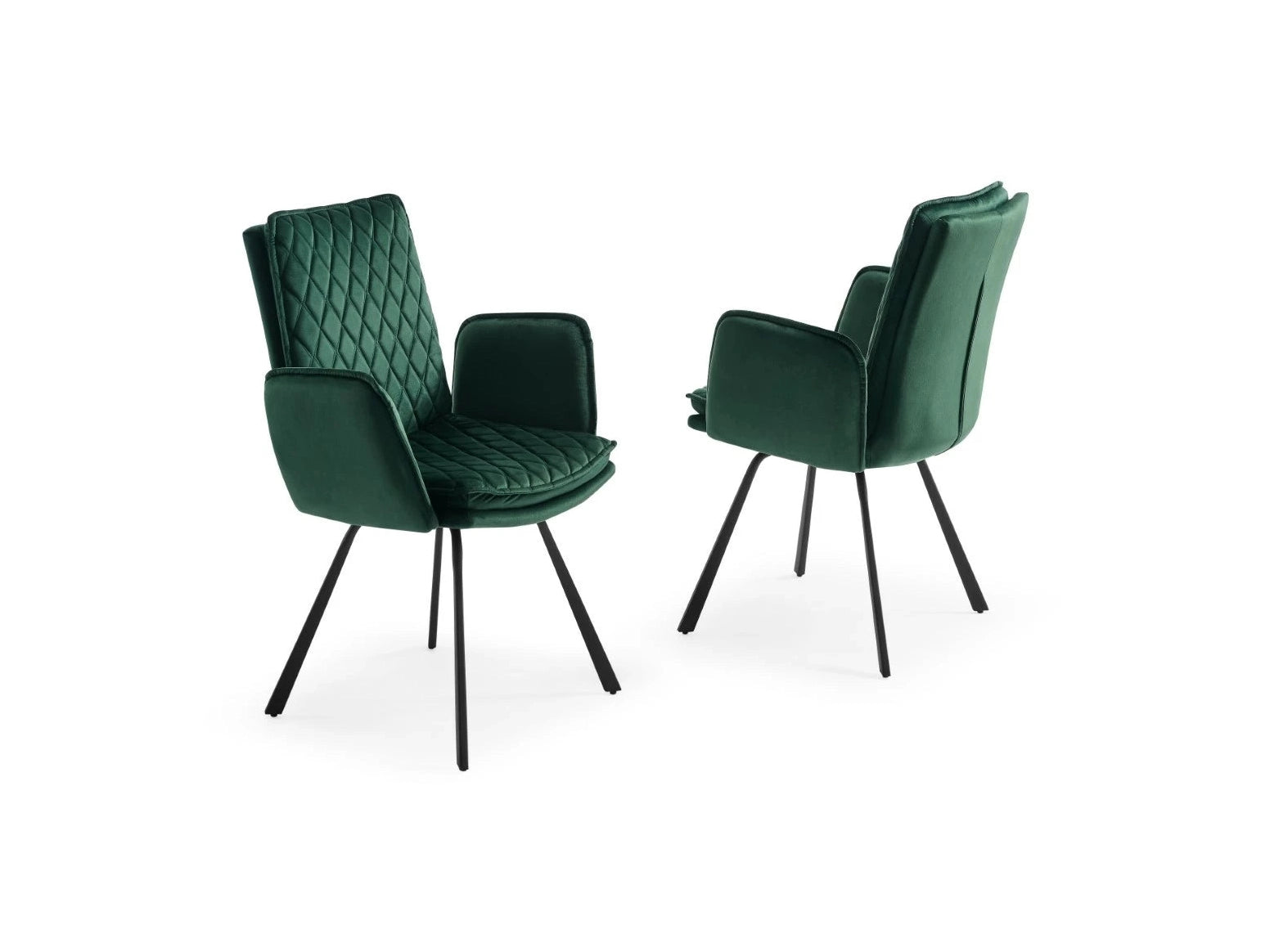Two emerald green velvet dining chairs feature elegant diamond-quilted upholstery and sleek black metal legs.
