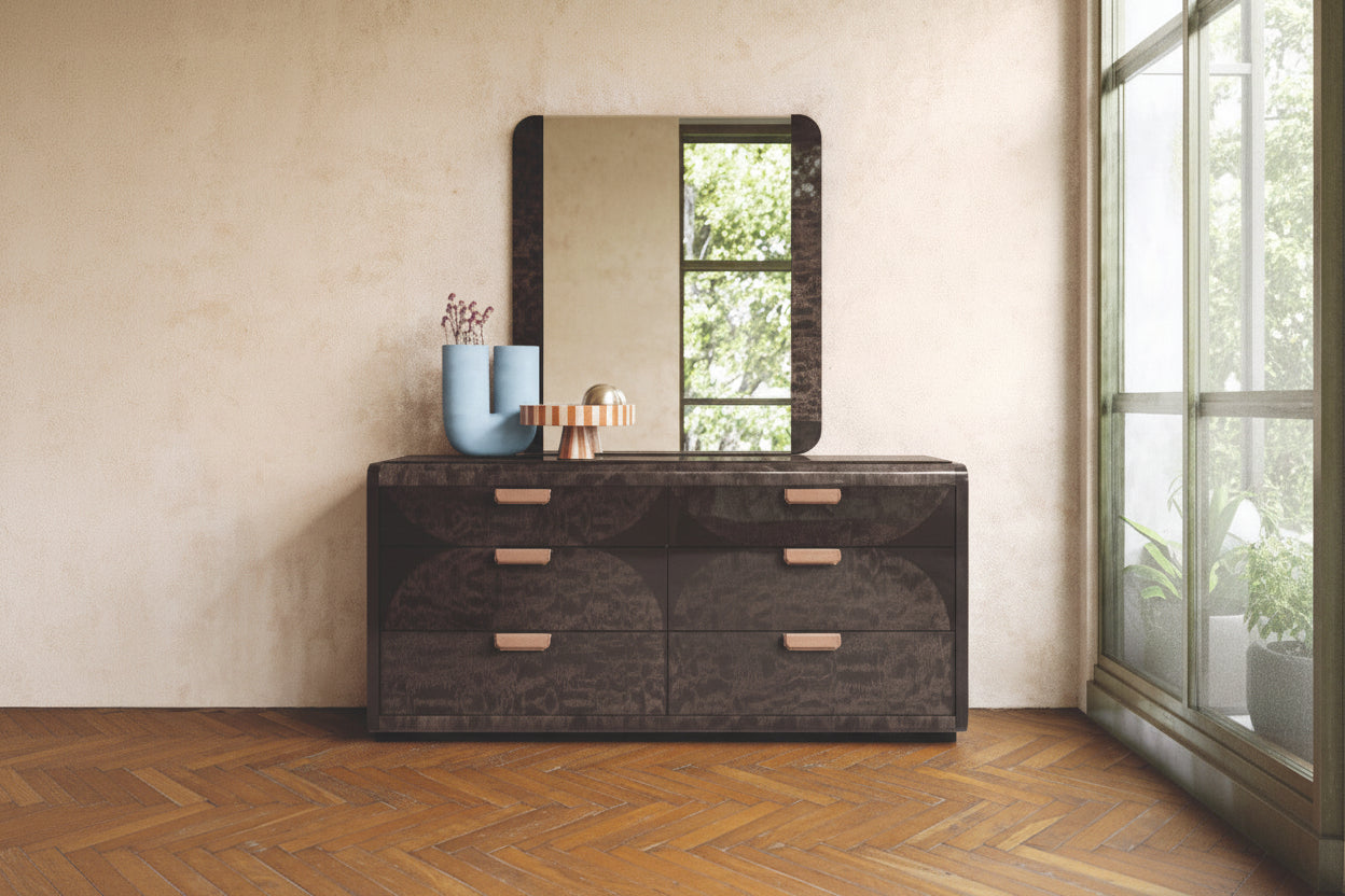 NYX dark wooden dresser with a mirror against a beige wall.