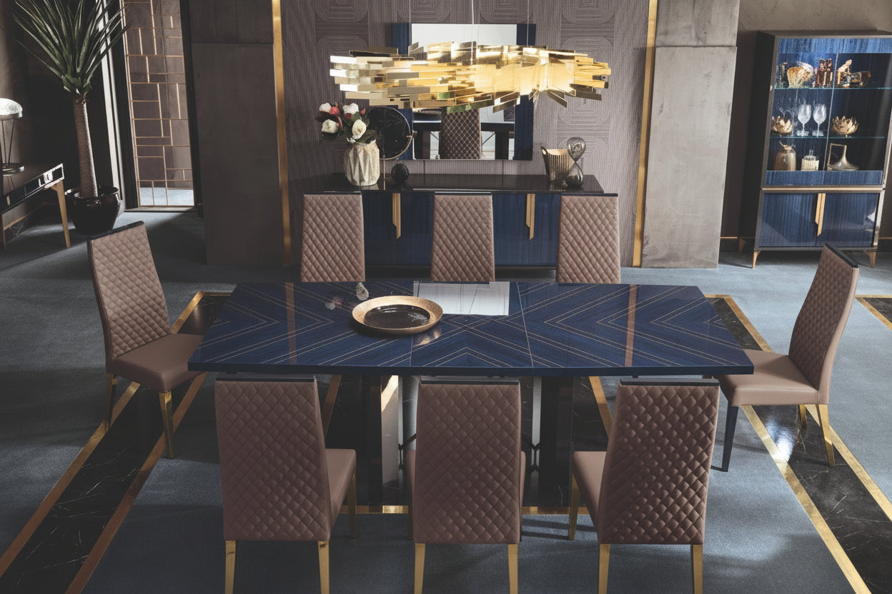 Modern dining room with a large dark blue table and chairs in a stylish interior.