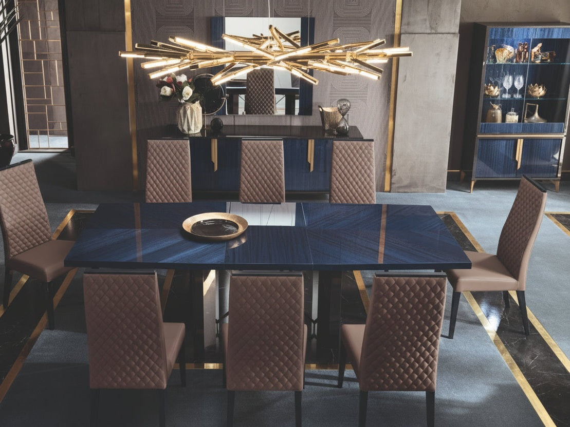 Oceanum modern dining room with a large dark blue table and chairs in a stylish interior.