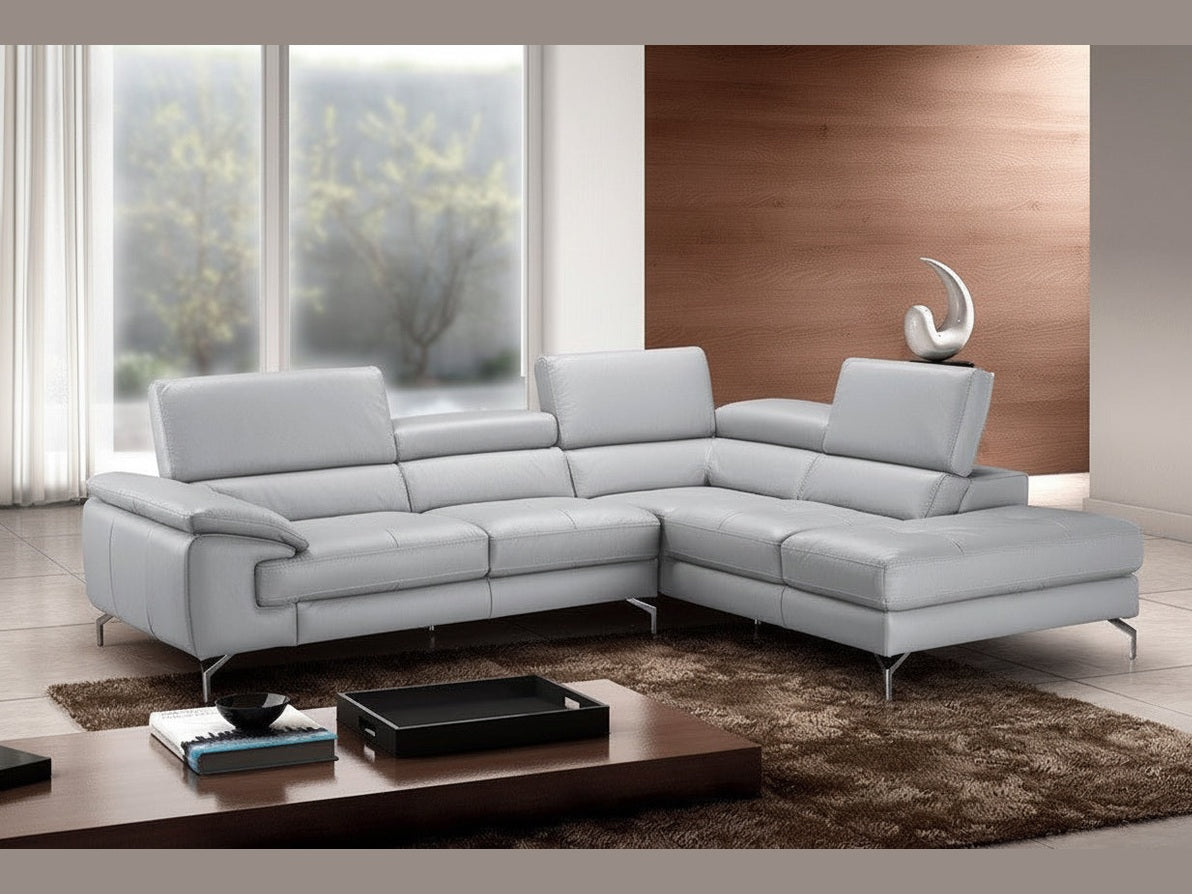 Olivia Gray sectional sofa in a modern living room with a wooden coffee table and decorative items.