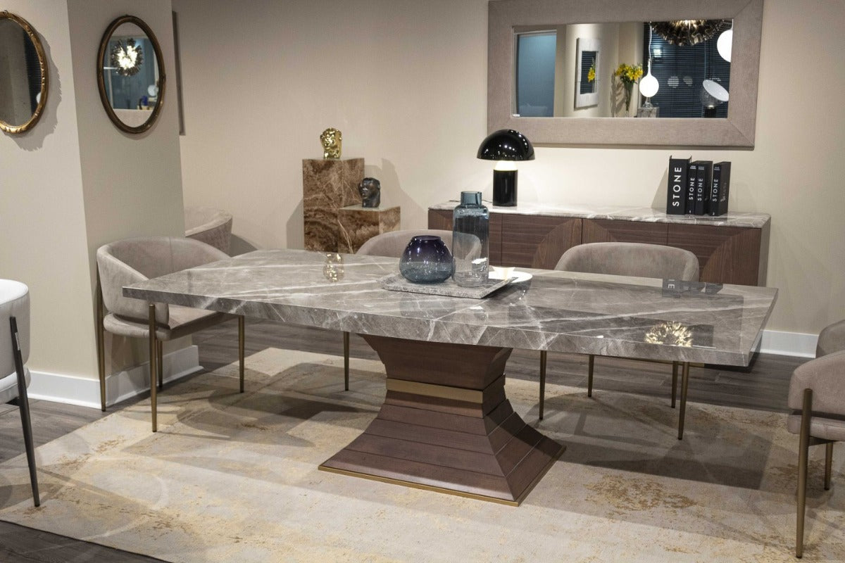 Modern dining room with marble table and chairs in a stylish interior setting.