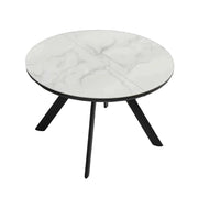 Orbit round table with white marble-like top and black legs on a gradient background