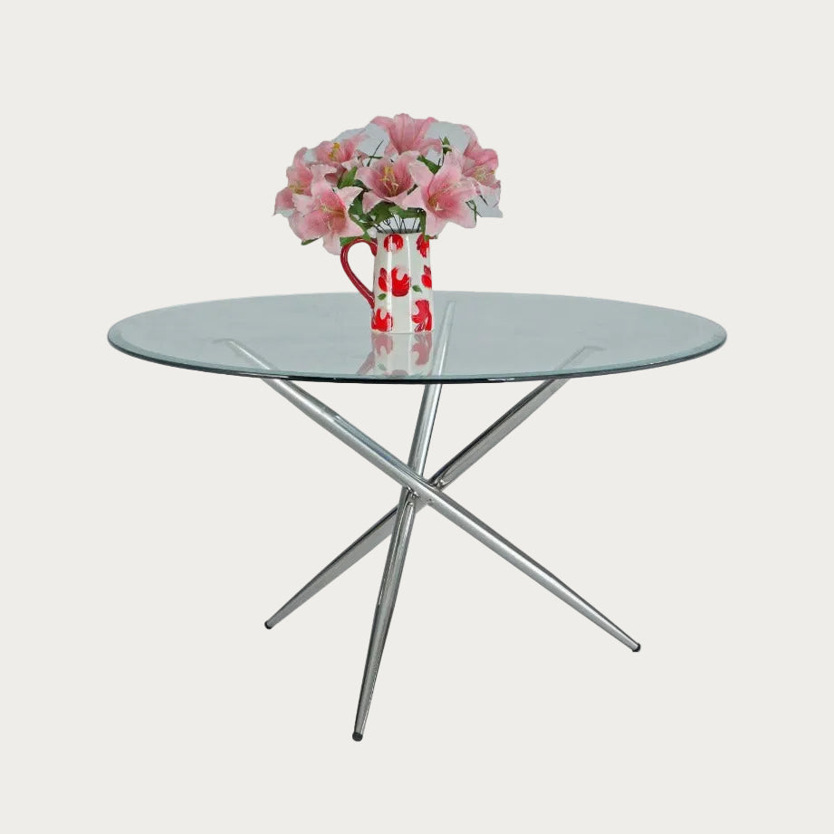 Patricia Round glass table with metal legs on a white background