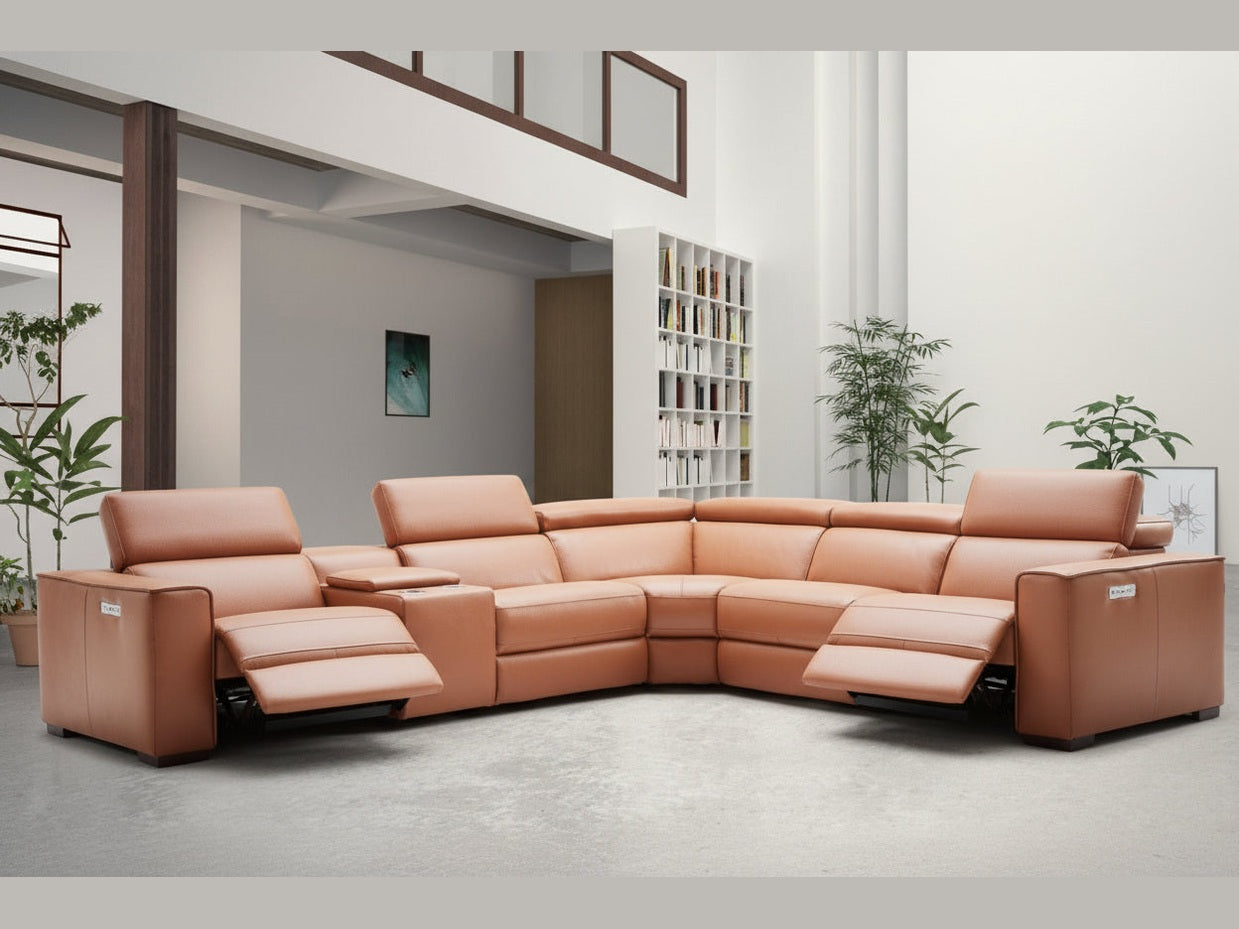 Caramel leather sectional sofa in a modern living room setting with plants and bookshelves.