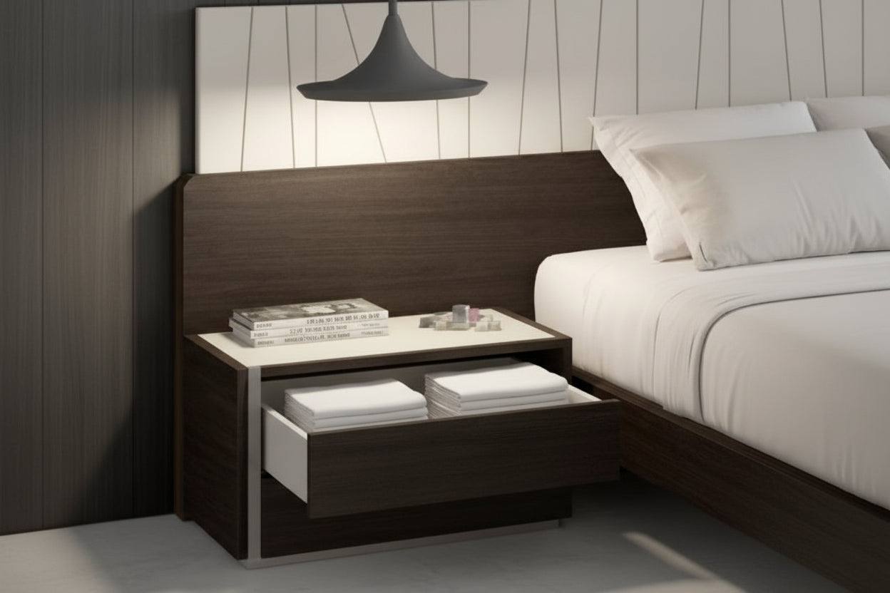 Porto bedroom setup with a bed and nightstand against a wooden headboard.
