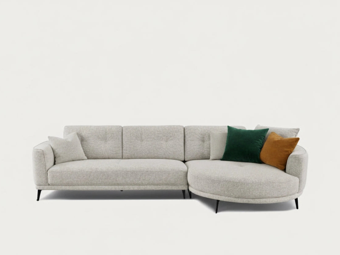 Rene sectional sofa with two pillows on a white background