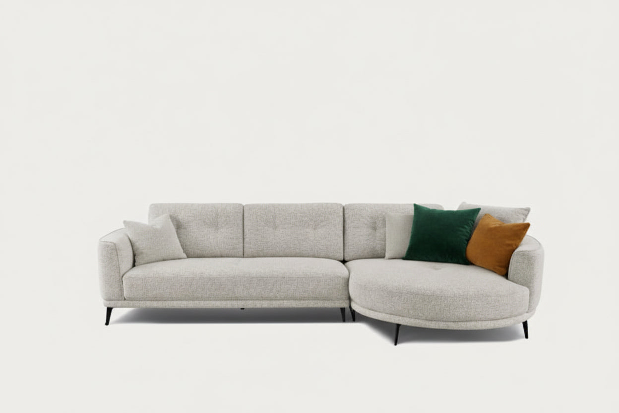 Rene sectional sofa with two pillows on a white background